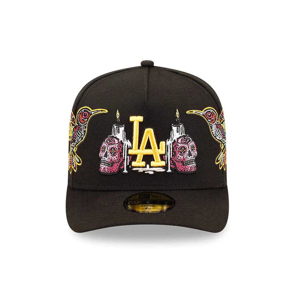 LA Dodgers MLB Day Of The Dead Black New Era 59FIFTY A-Frame Fitted Cap, front view showing yellow LA logo with intricate multicoloured skull and hummingbird embroidery on the structured black crown.