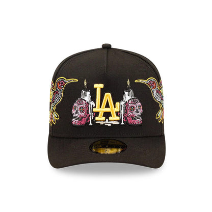 LA Dodgers MLB Day Of The Dead Black New Era 59FIFTY A-Frame Fitted Cap, front view showing yellow LA logo with intricate multicoloured skull and hummingbird embroidery on the structured black crown.