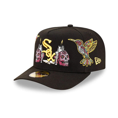 Chicago White Sox MLB Day Of The Dead Black New Era 59FIFTY A-Frame Fitted Cap, three-quarter view showing yellow and pink embroidered skulls beside the team logo, a colourful hummingbird.