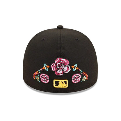 Chicago White Sox MLB Day Of The Dead Black New Era 59FIFTY A-Frame Fitted Cap, rear view featuring embroidered flowers, including a large central pink rose, colourful floral accents, and a gold MLB Batterman logo at the centre back.