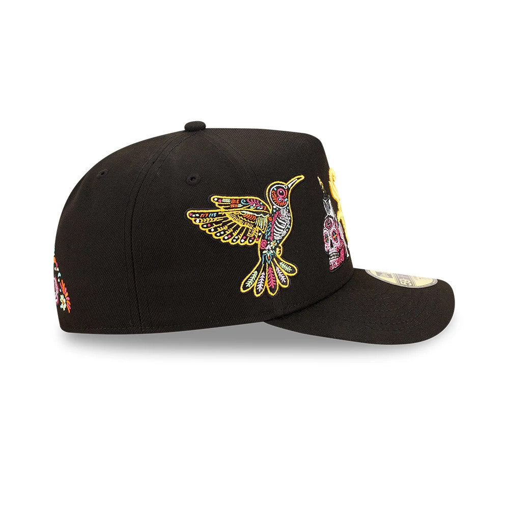 Chicago White Sox MLB Day Of The Dead Black New Era 59FIFTY A-Frame Fitted Cap, side view showing a colourful embroidered bird on the centre panel, intricate skull design toward the front, and the 59FIFTY size sticker on the black visor.