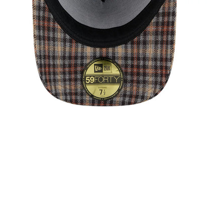 Yankees MLB Fabric Story Black New Era 59FORTY A-Frame Fitted Cap, inside view showcasing a patterned plaid underside, black sweatband detail, and prominently placed 59FORTY size sticker at the centre with New Era branding.