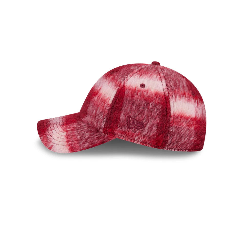 New Era LA Dodgers MLB Fabric Story Red Casual Classic Adjustable Cap, side view with the red and white tie-dye fabric creating a unique texture, featuring a red New Era flag logo on the left side and a curved visor.