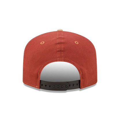 New York Yankees MLB Fall Story Multi New Era 19TWENTY Adjustable Cap, rear view showing the strapback closure in black with multiple adjustment holes, a structured rust-coloured cotton crown with eyelets, and a matching top button.