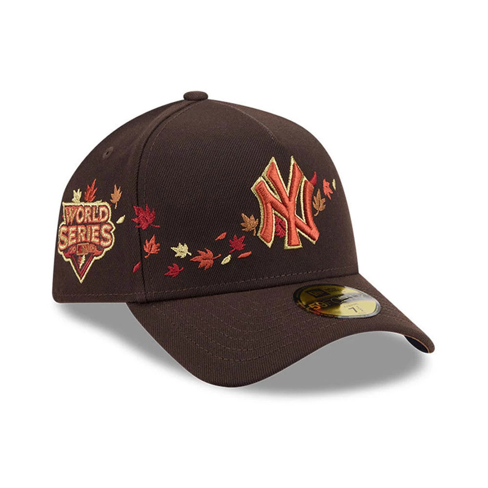 Yankees MLB Fall Story Dark Brown New Era 59FORTY A-Frame Fitted Cap, three-quarter view showing a raised orange and red NY logo on the front panel, embroidered autumn leaves and a World Series patch on the right side.