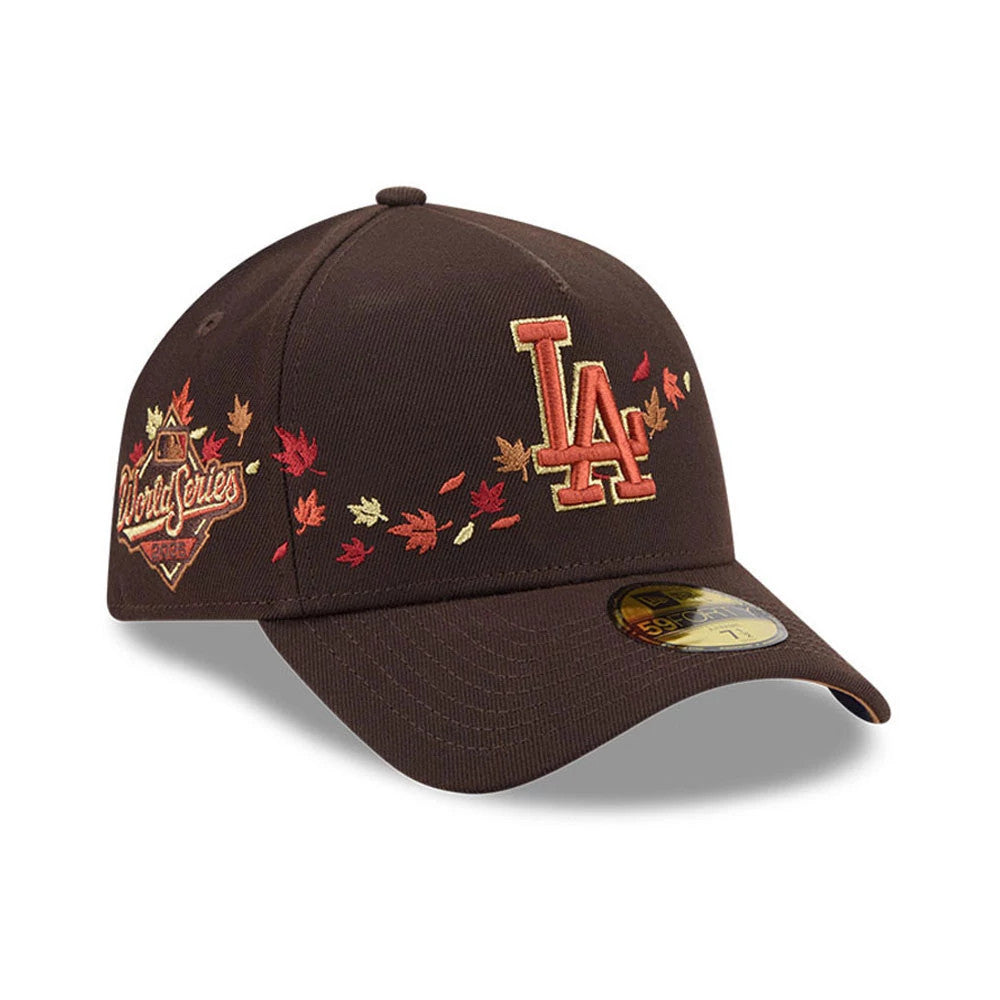 LA Dodgers MLB Fall Story Dark Brown New Era 59FORTY A-Frame Fitted Cap, three-quarter view showing the raised LA logo in autumnal tones on the front, surrounded by embroidered fall leaves, with a 59FORTY size sticker on the curved visor.