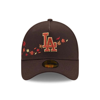 LA Dodgers MLB Fall Story Dark Brown New Era 59FORTY A-Frame Fitted Cap, front view showing the raised LA logo embroidered in autumn hues on the brown crown, with scattered leaf embroidery and a gold 59FORTY size sticker on the curved visor.