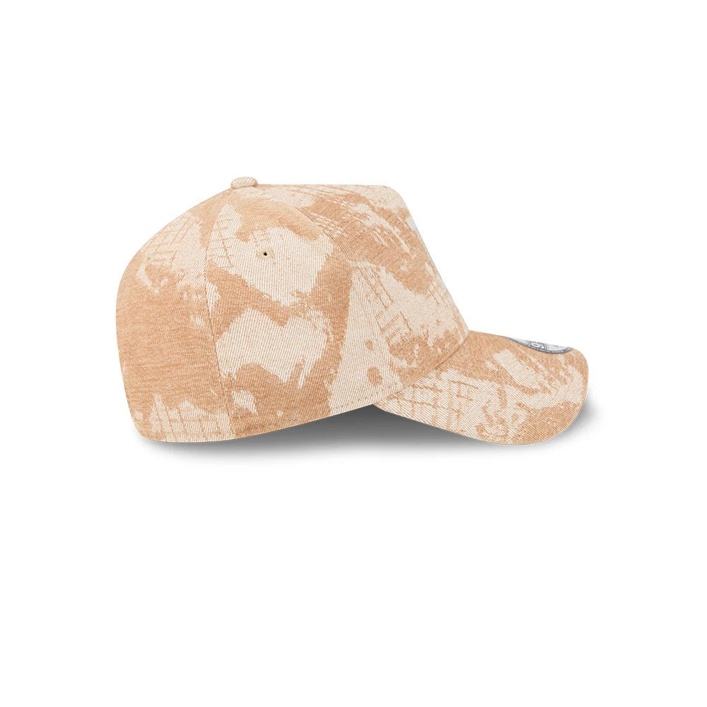 LA Dodgers MLB Fall Story Beige New Era 9FORTY A-Frame Adjustable Cap, side view showing a uniquely patterned beige fabric across the crown and curved visor, with a single eyelet on each panel and the New Era flag logo embroidered on the left side.