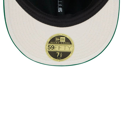 Eagles NFL Historic Arch Green Retro Crown New Era 59FIFTY Fitted Cap, inside view displaying a black sweatband, the white undervisor with green edge, and a gold 59FIFTY size sticker on the underside of the flat visor.