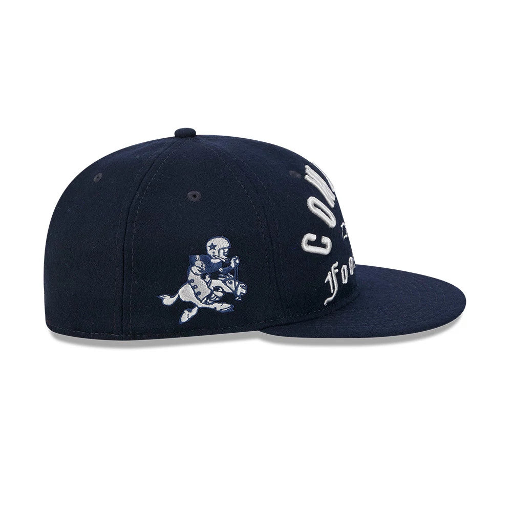 Dallas Cowboys NFL Historic Arch Dark Blue Retro Crown New Era 59FIFTY Fitted Cap, side view showing the detailed embroidered Cowboys mascot graphic on the dark blue structured crown, with white Cowboys lettering across the front panel.