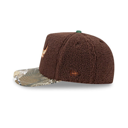 Chicago Bulls NBA Hardwood Classic Brown New Era 59FIFTY A-Frame Fitted Cap, side view showing the textured brown crown with the embroidered New Era flag logo in brown on the left side and a camouflage-patterned flat visor.