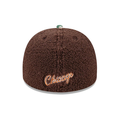 Chicago Bulls NBA Hardwood Classic Brown New Era 59FIFTY A-Frame Fitted Cap, rear view showing the textured brown fleece crown with orange embroidered script 'Chicago' lettering at the centre back and a green top button.