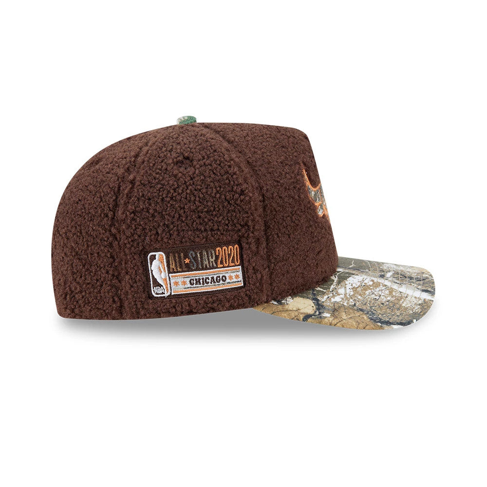 Chicago Bulls NBA Hardwood Classic Brown New Era 59FIFTY A-Frame Fitted Cap, side view showing the embroidered All-Star 2020 patch on the brown textured crown, with a camouflage visor, and a Chicago Bulls logo on the front panel.