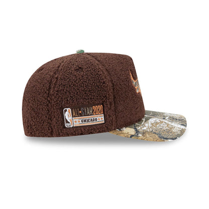 Chicago Bulls NBA Hardwood Classic Brown New Era 59FIFTY A-Frame Fitted Cap, side view showing the embroidered All-Star 2020 patch on the brown textured crown, with a camouflage visor, and a Chicago Bulls logo on the front panel.