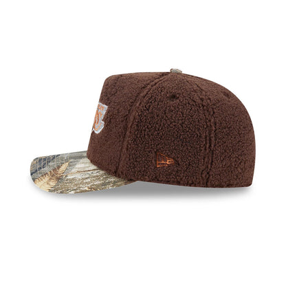 LA Lakers NBA Hardwood Classic Brown New Era 59FIFTY A-Frame Fitted Cap, side view showing the orange New Era flag logo embroidered on the left, a textured brown crown, and a patterned flat visor featuring tree and leaf designs.