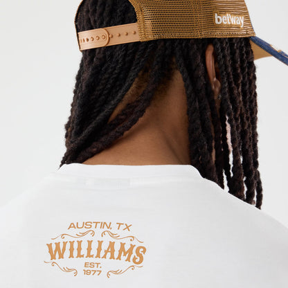 The model is wearing this Williams Austin Race Special Graphic Oversized T-Shirt in white. 5