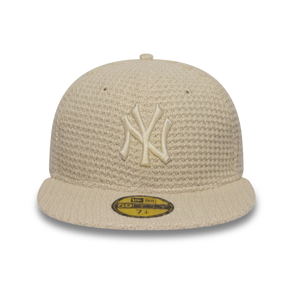 New York Yankees MLB Knitted Light Beige New Era 59FIFTY Fitted Cap, front view showing the raised embroidered NY logo on the structured crown, light beige textured knit fabric, and gold 59FIFTY size sticker on the flat visor.