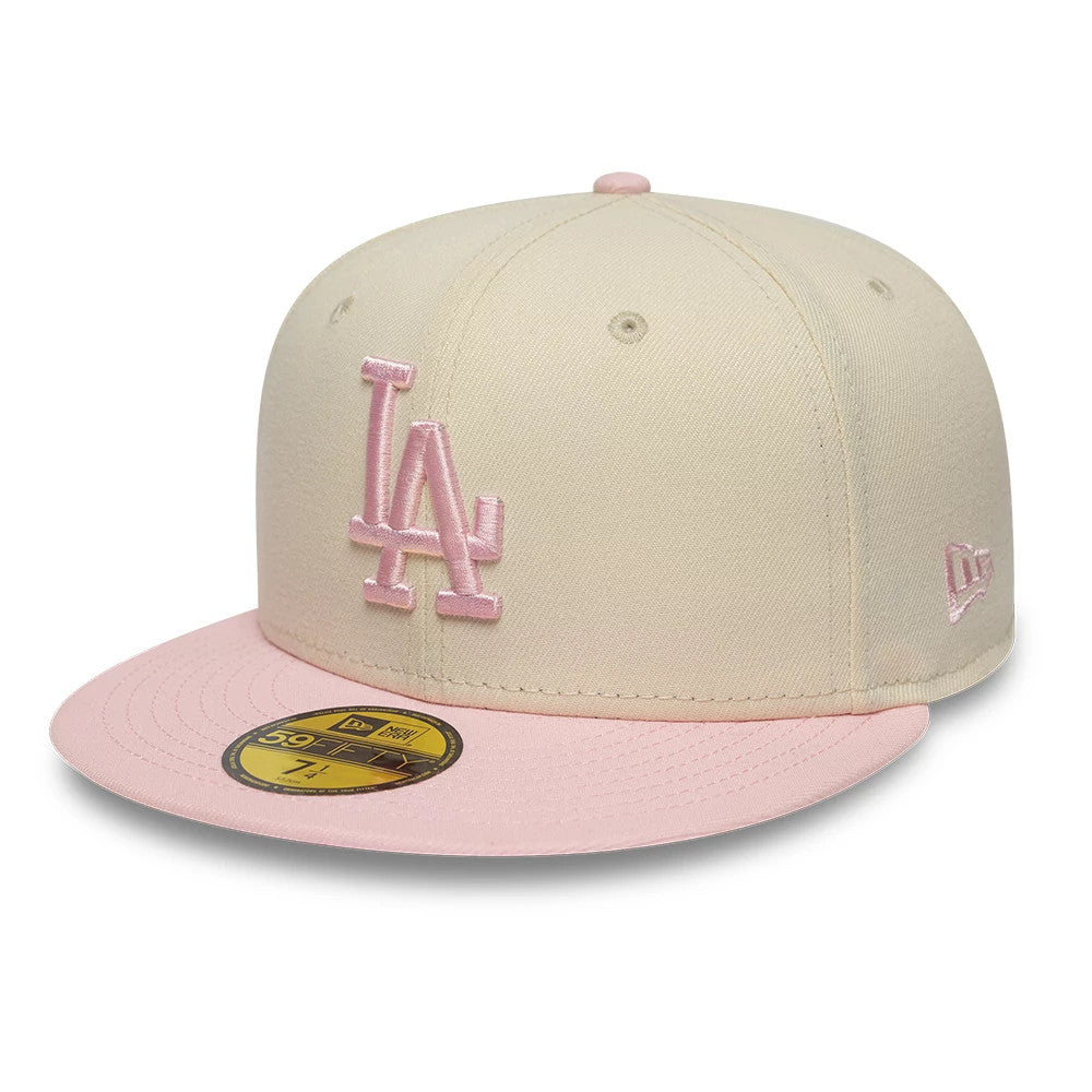 Pictured is this MLB League Essential LA Dodgers 59FIFTY Fitted cap in cream & pink. 1
