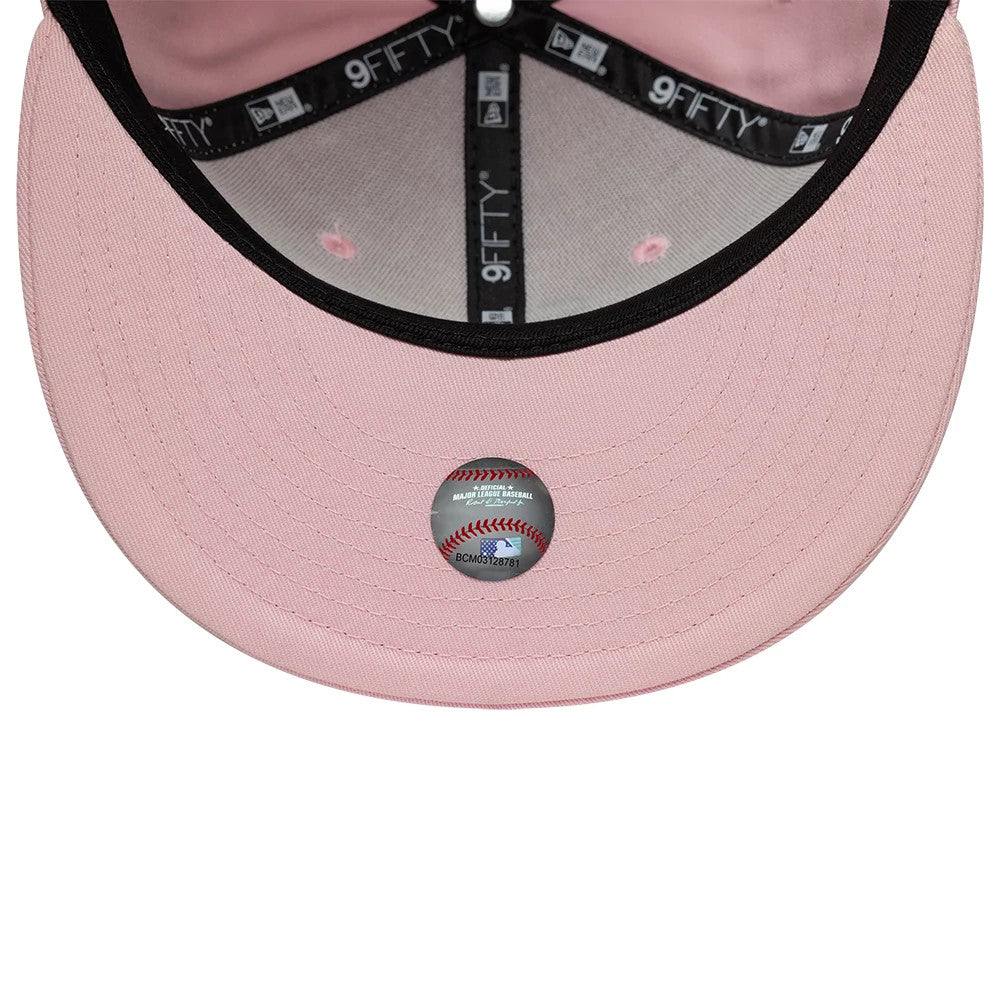Pictured is this MLB Outline LA Dodgers 9FIFTY Snapback cap in pastel pink. 7