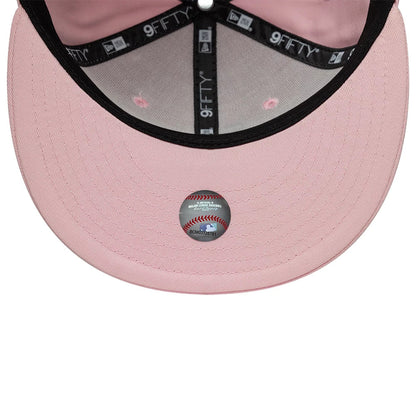 Pictured is this MLB Outline LA Dodgers 9FIFTY Snapback cap in pastel pink. 7
