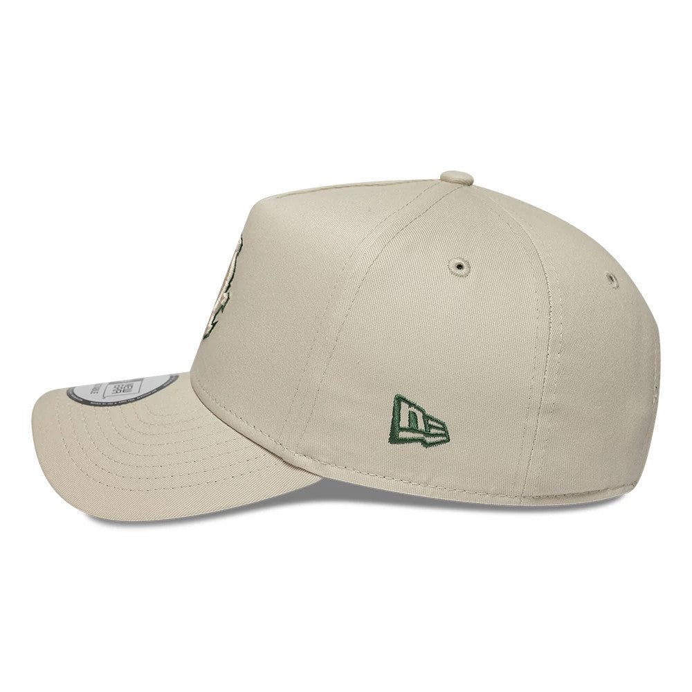 White Sox MLB Team Outline Light Beige New Era 9FORTY E-Frame Adjustable Cap, side view showing the green embroidered New Era flag logo on the left side, a curved visor with stitching, and a structured crown.