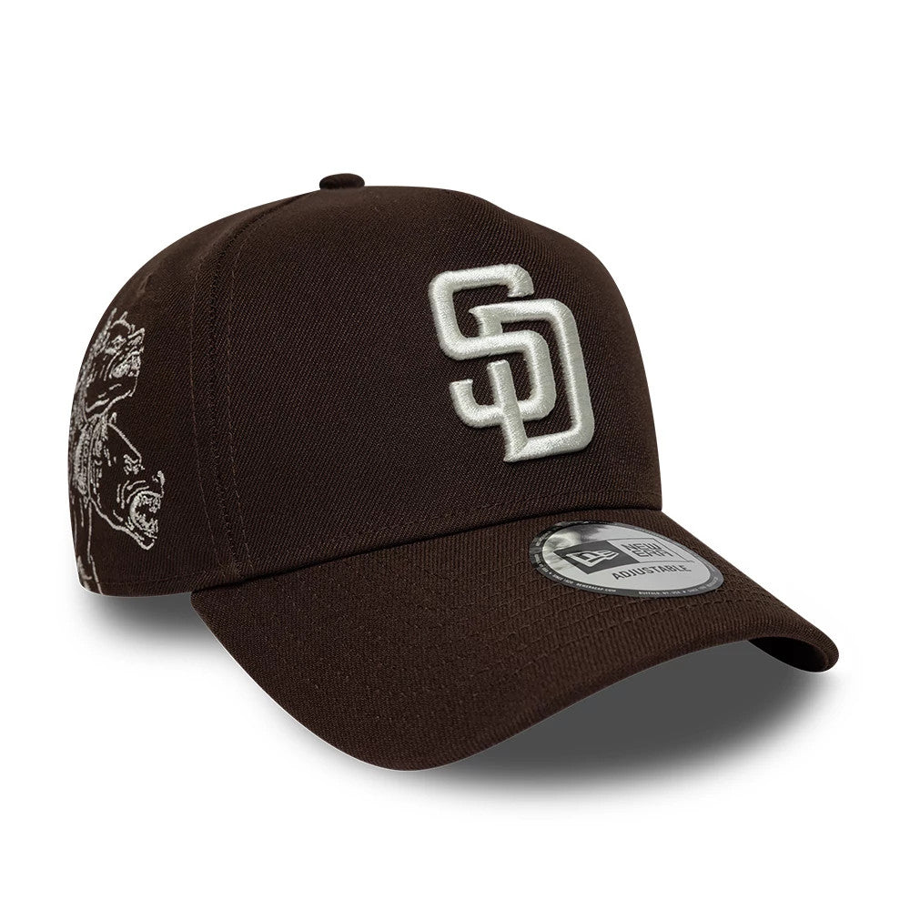 Padres MLB Mythical Icon Dark Brown New Era 9FORTY E-Frame Adjustable Cap, three-quarter view showing the raised white SD logo on the front panel, a dark brown curved visor with a 9FORTY size sticker, and a mythical graphic on the side.