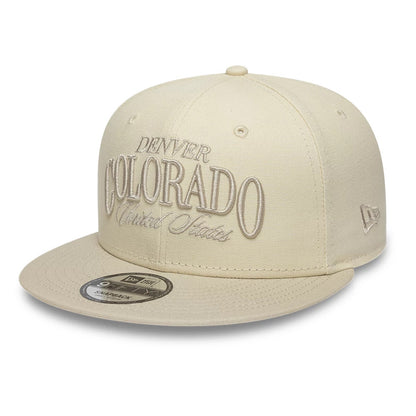Pictured is this New Era Fabric Script 9FIFTY Snapback cap in Cream & black. 1