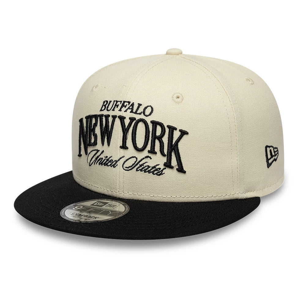Pictured is this New Era Fabric Wordmark New Era 9FIFTY Snapback cap in cream & black. 1