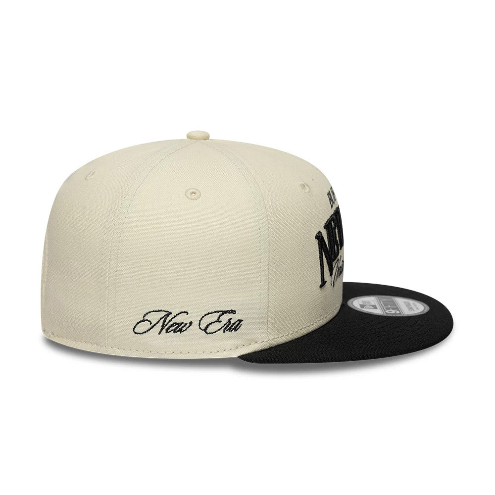 Pictured is this New Era Fabric Wordmark New Era 9FIFTY Snapback cap in cream & black. 5
