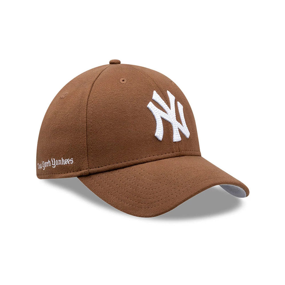 Pictured is this MLB Melton New York Yankees 39THIRTY Stretch Fit cap in dark brown. 1
