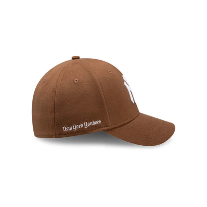 Pictured is this MLB Melton New York Yankees 39THIRTY Stretch Fit cap in dark brown. 5