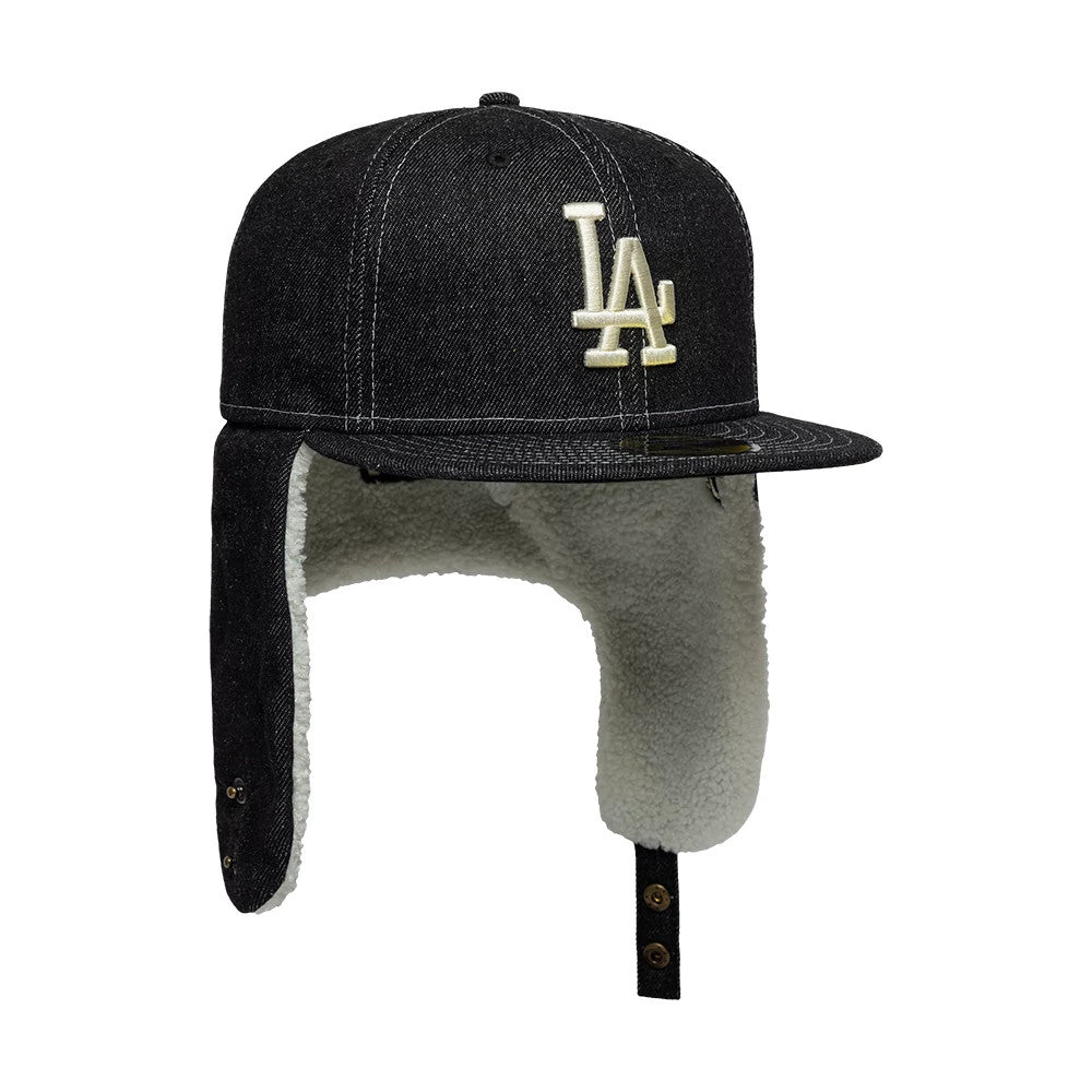 LA Dodgers MLB Denim Black New Era 59FIFTY Fitted Cap, side view showing the raised white embroidered LA logo on the structured black denim crown, with attached faux shearling-lined dogear flaps and a flat-visor featuring a classic design.
