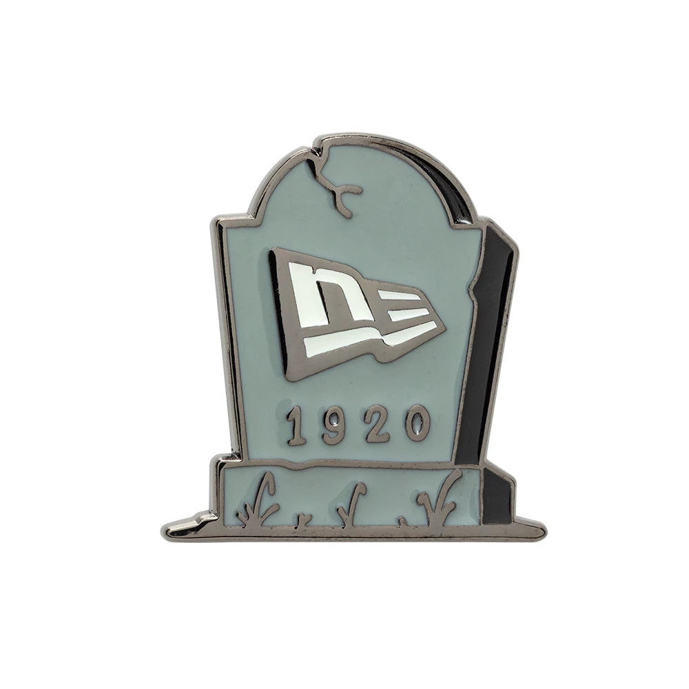 Pictured is this New Era Halloween Grave Pin Badge in grey. 1