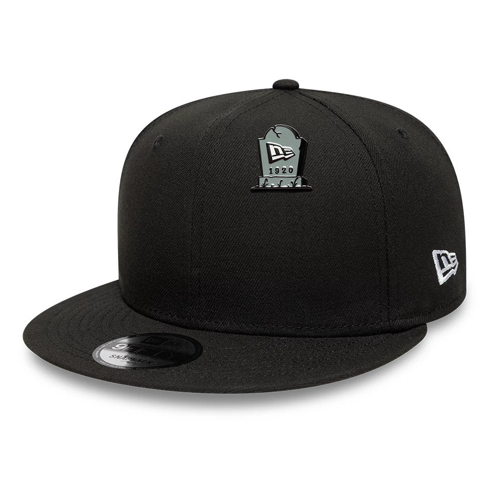 Pictured is this New Era Halloween Grave Pin Badge in grey. 2