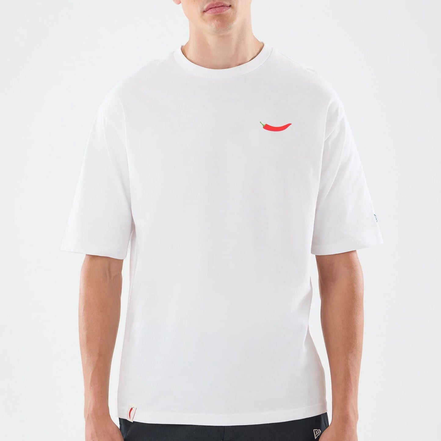 The model is wearing this Carlos Sainz Team Fifty5 Oversized T-Shirt in white. 3