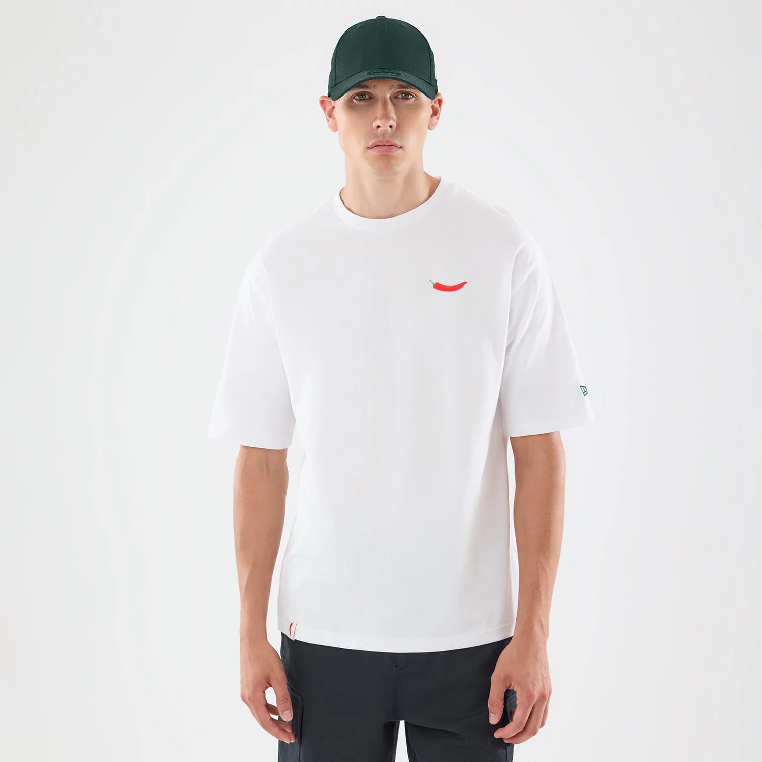 The model is wearing this Carlos Sainz Team Fifty5 Oversized T-Shirt in white. 1
