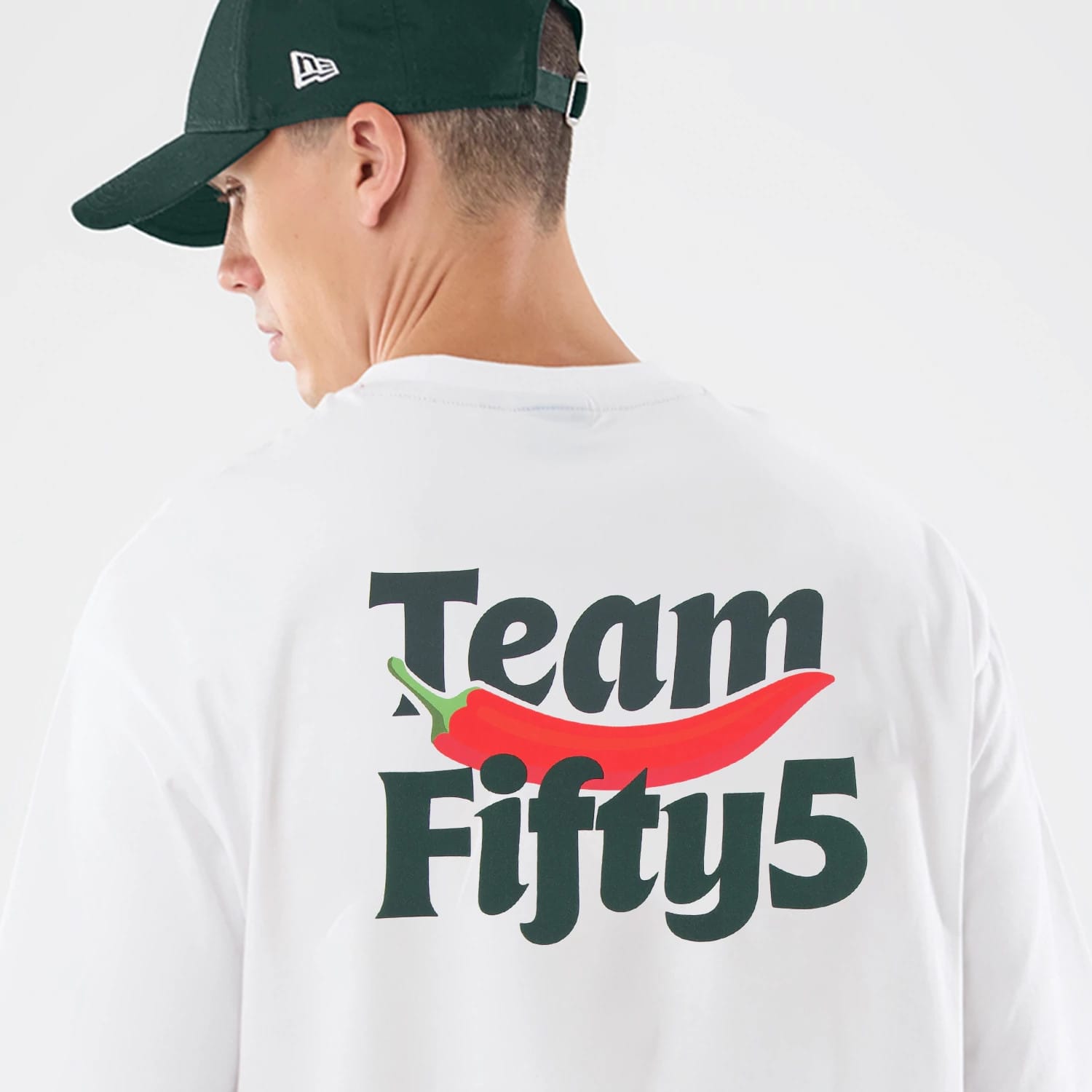 The model is wearing this Carlos Sainz Team Fifty5 Oversized T-Shirt in white. 6