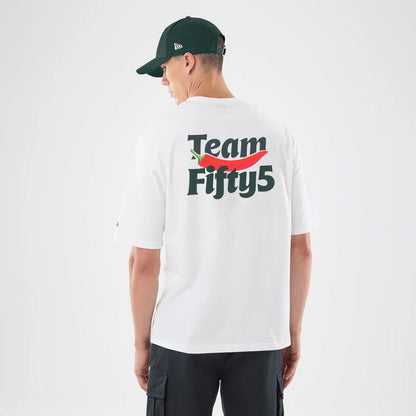 The model is wearing this Carlos Sainz Team Fifty5 Oversized T-Shirt in white. 2