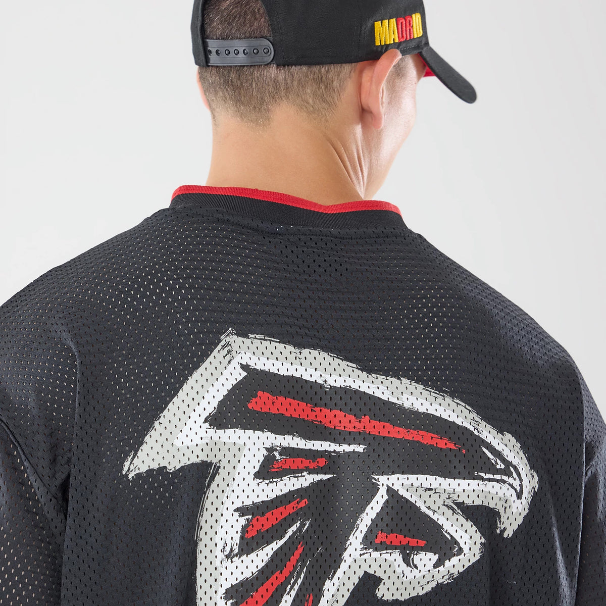 The model is wearing this NFL International Games 2026 Graphic Atlanta Falcons Mesh Jersey in black. 4