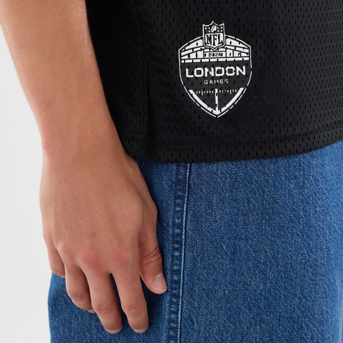 The model is wearing this NFL International Series Games 2026 Graphic Jacksonville Jaguars Mesh Jersey in black. 5
