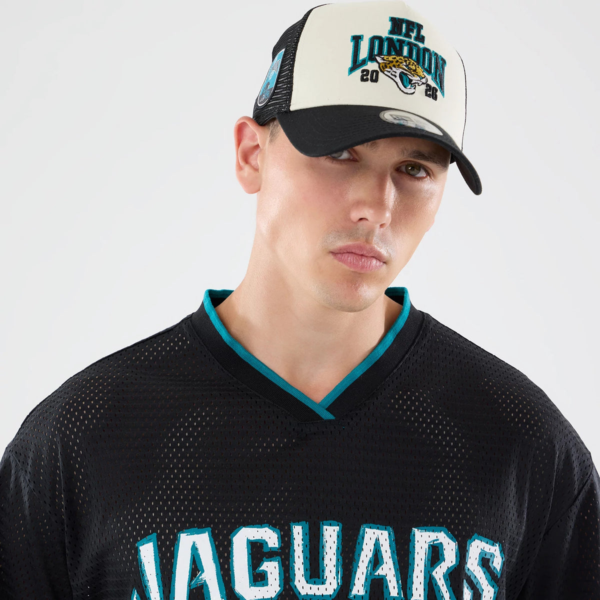 The model is wearing this NFL International Series Games 2026 Graphic Jacksonville Jaguars Mesh Jersey in black. 4