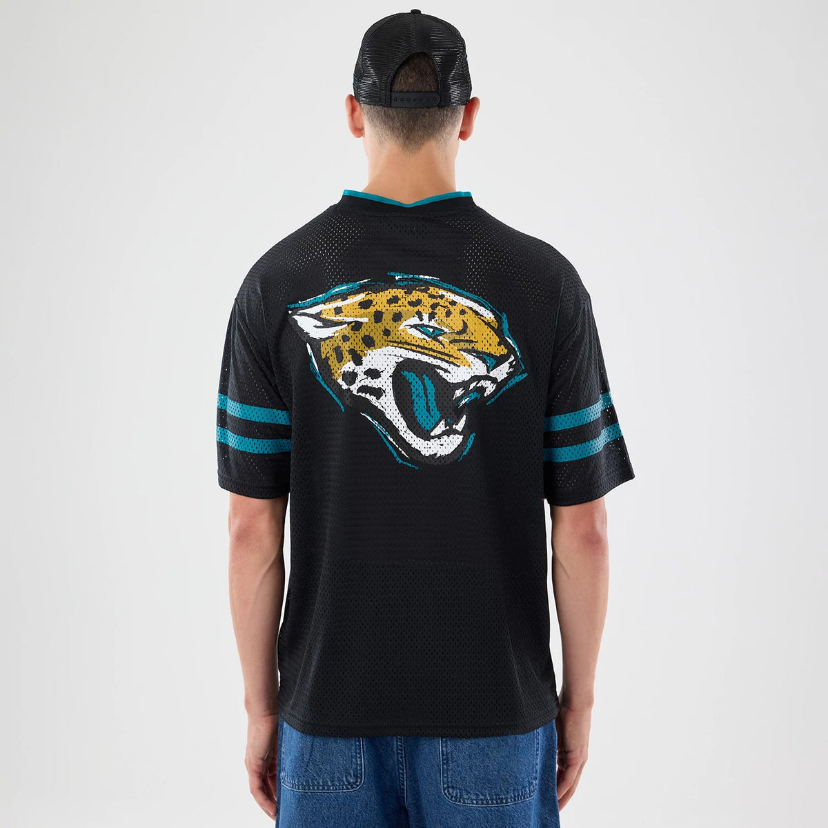 The model is wearing this NFL International Series Games 2026 Graphic Jacksonville Jaguars Mesh Jersey in black. 2