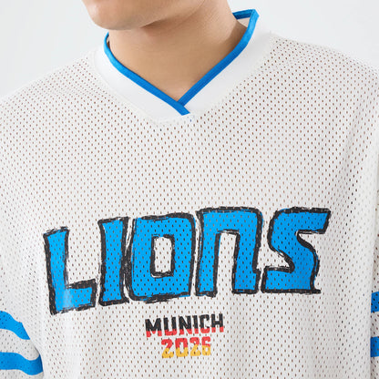 The model is wearing this NFL International Series Games 2026 Graphic Detroit Lions Mesh Jersey in white. 6