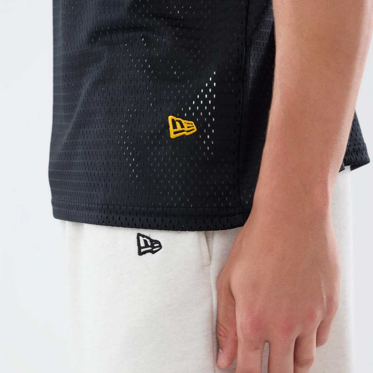 The model is wearing this NFL International Games 2026 Graphic Washington Commanders Mesh Jersey in black. 6