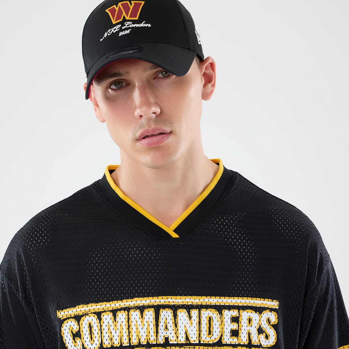 The model is wearing this NFL International Games 2026 Graphic Washington Commanders Mesh Jersey in black. 7