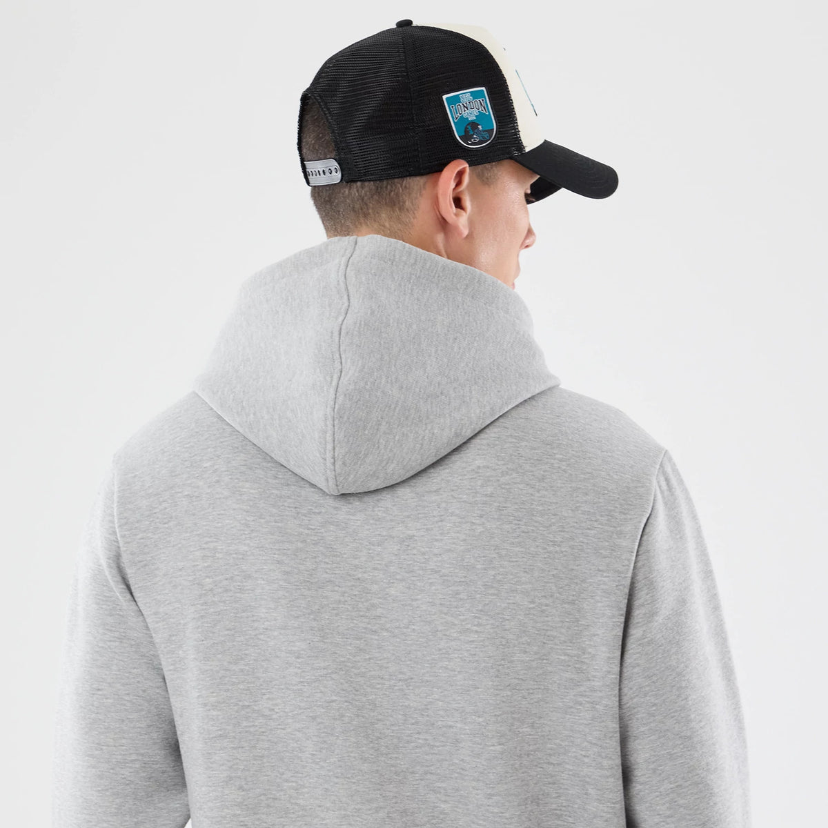 The model is wearing this NFL Patch Jacksonville Jaguars Pullover Hoodie in grey. 7