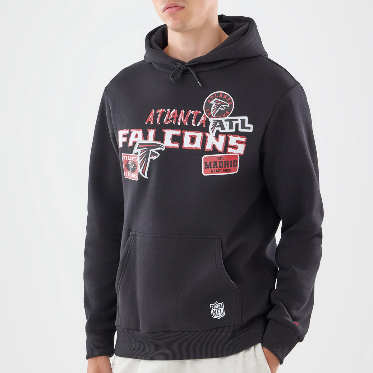 The model is wearing this NFL Patch Atlanta Falcons Pullover Hoodie in black. 3