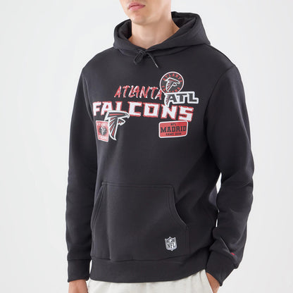 The model is wearing this NFL Patch Atlanta Falcons Pullover Hoodie in black. 3