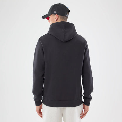 New Era Atlanta Falcons NFL Patch Black Pullover Hoodie, back view on a model also wearing a black cap, showing the plain black hoodie with a simple design, an attached hood, and ribbed cuffs and hem for a classic look.