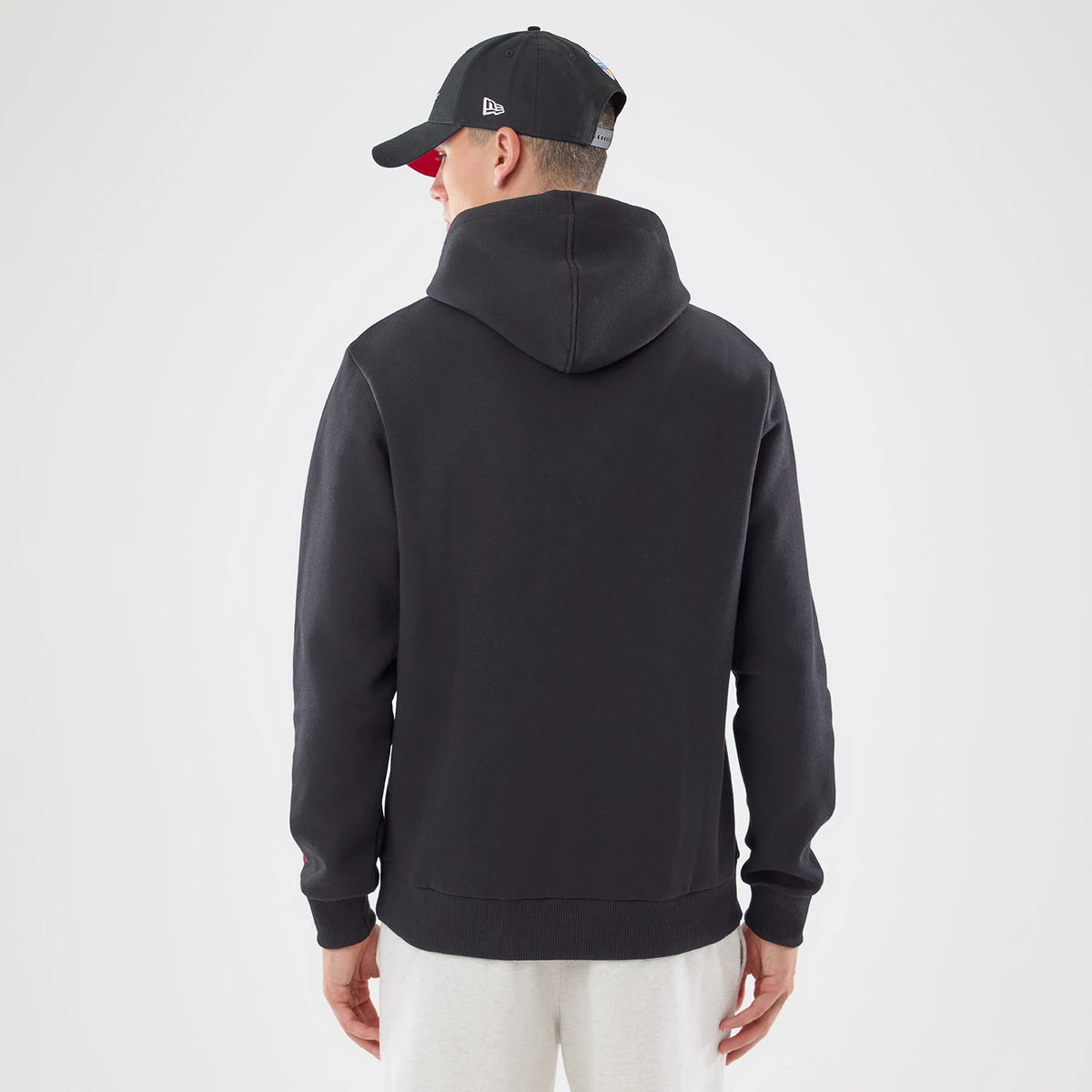 The model is wearing this NFL Patch Atlanta Falcons Pullover Hoodie in black. 2